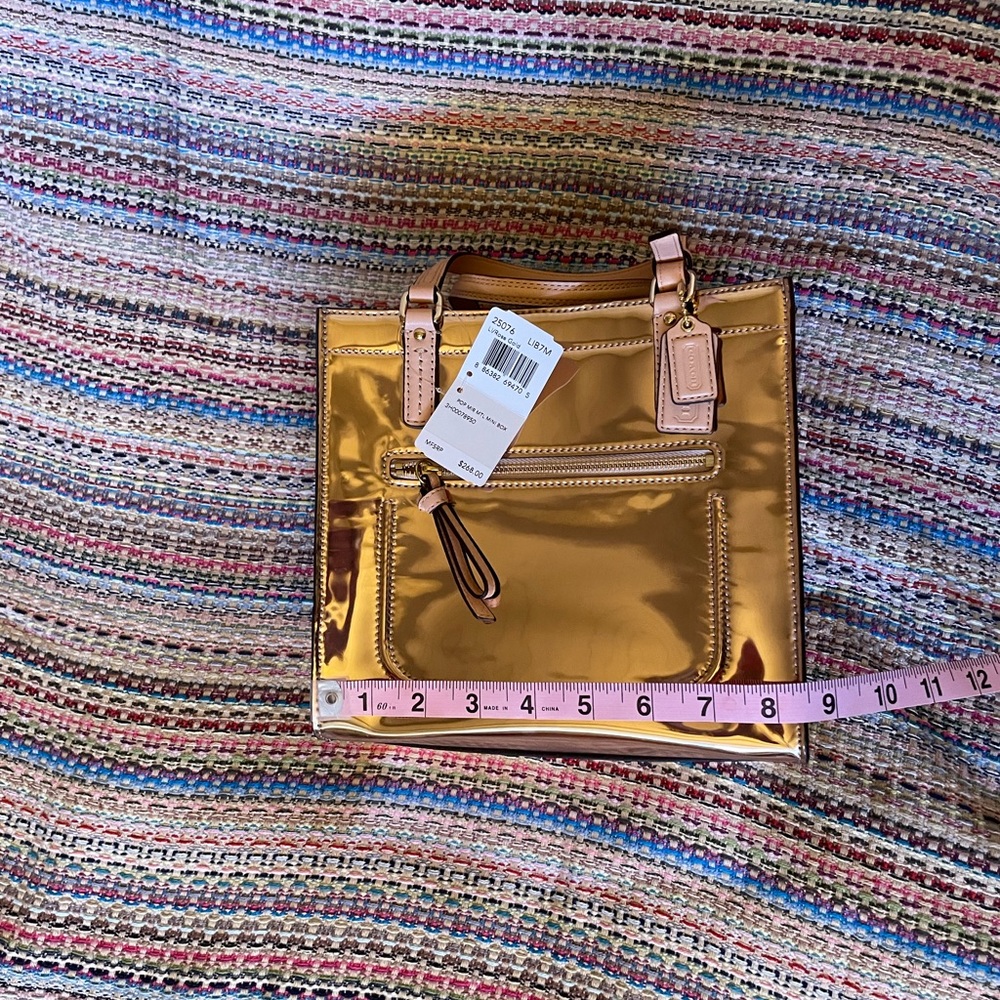 NWT Coach rose gold patent leather handbag